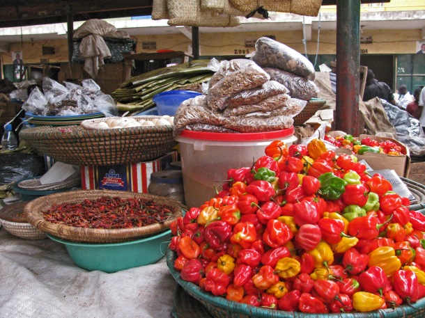 Food stall in Owino market, Kampala, Uganda. Scotch bonnet peppers, chilli, baskets, Africa
